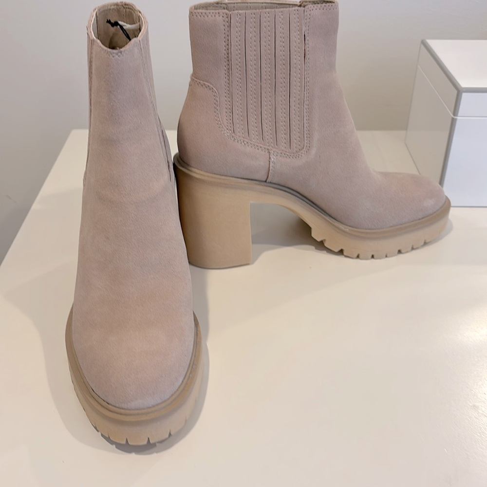 New.  Never been worn Dolce Vita lug sole booties.  Perfect condition